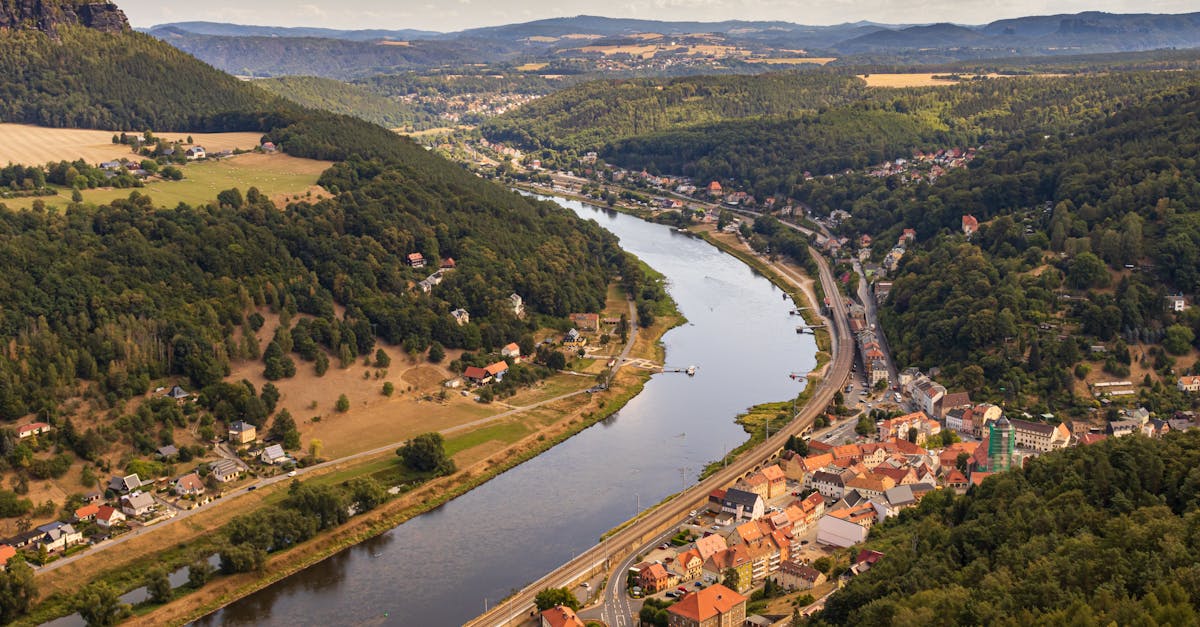 Explore the breathtaking aerial view of the Elbe River winding through the scenic landscape of Saxony.