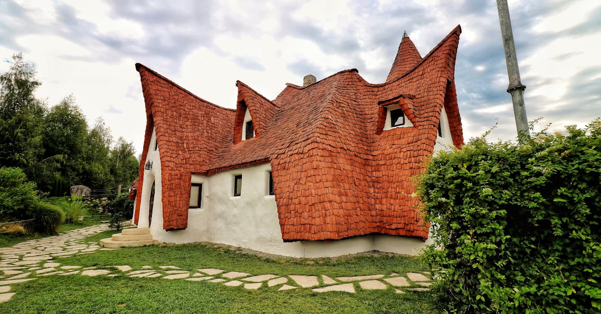 Explore this unique fairy tale cottage with whimsical architecture in Romania's scenic countryside.