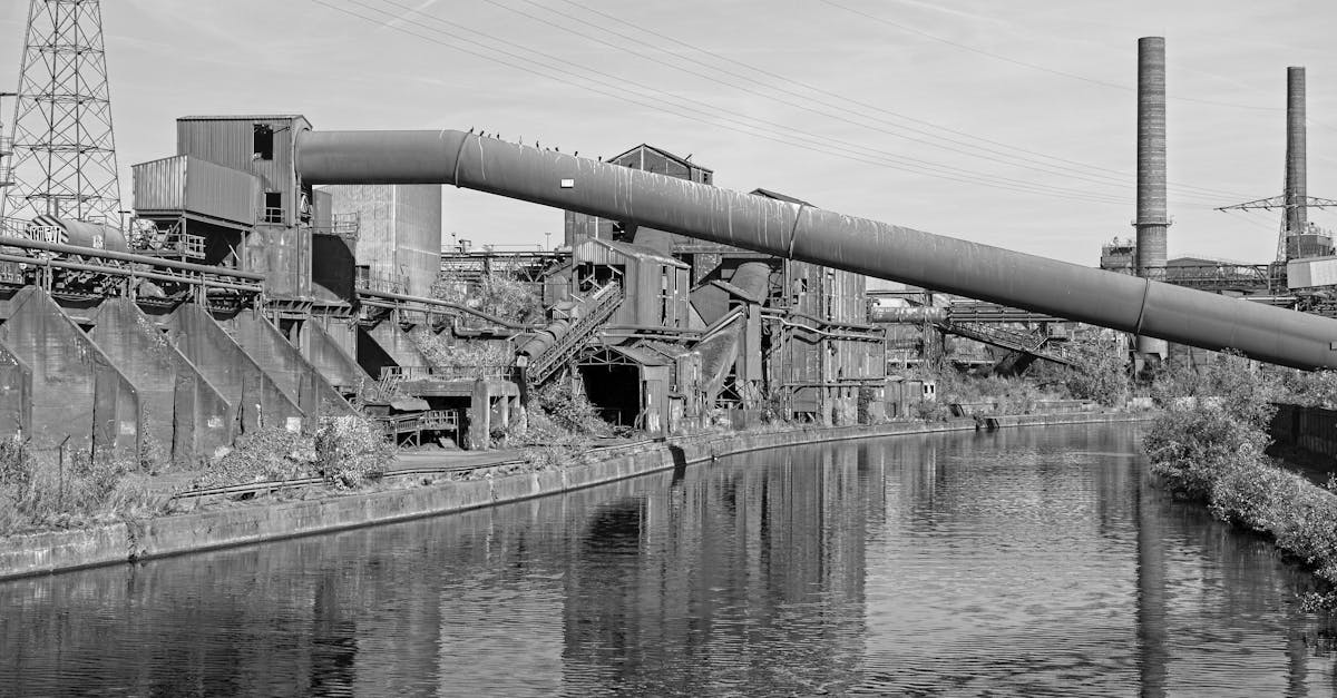 Black and white photo of an industrial scene with chimneys in Charleroi, Belgium.
