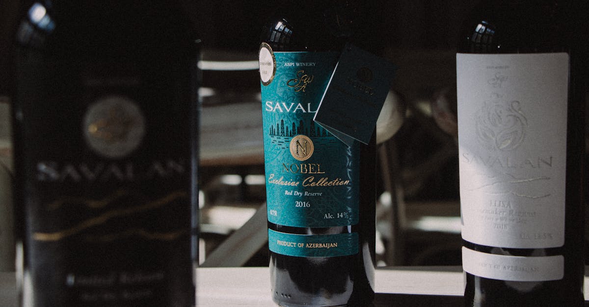 Three Savalan wine bottles arranged on a table, showcasing labels and brand.