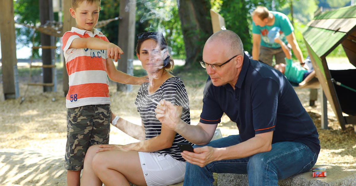 A family enjoying a sunny day at the park, capturing casual moments and interactions.