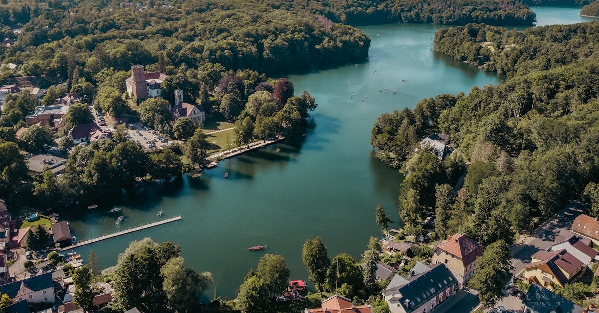 A breathtaking aerial view of Łagów, Poland, showcasing lush forests and tranquil lakes.