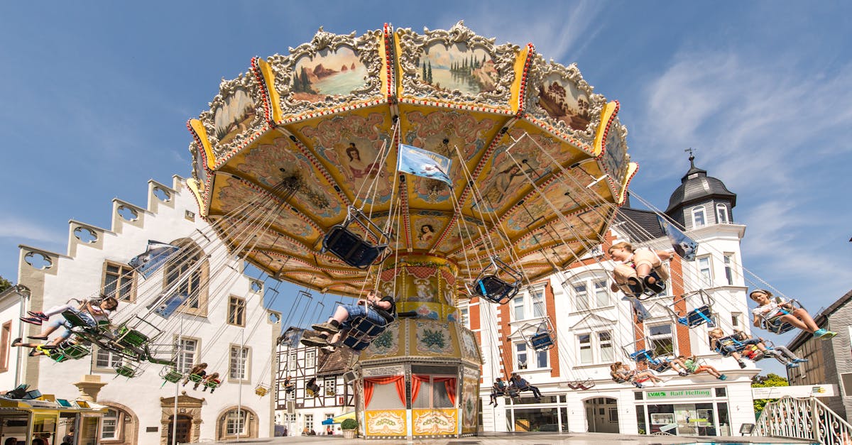 Enjoy the lively carousel in Brakel's historic town square, showcasing vibrant summer fun.