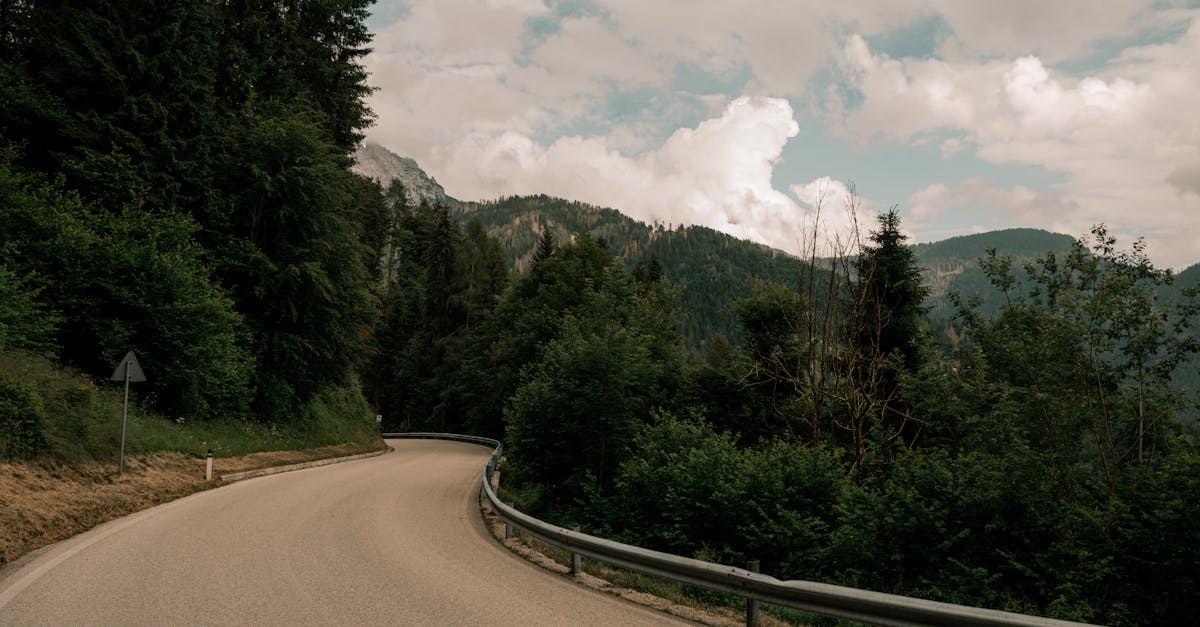 A winding road through lush mountains, creating a scenic and tranquil landscape.