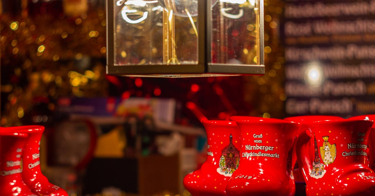 Festive red mugs on display at the Nuremberg Christmas Market night scene.