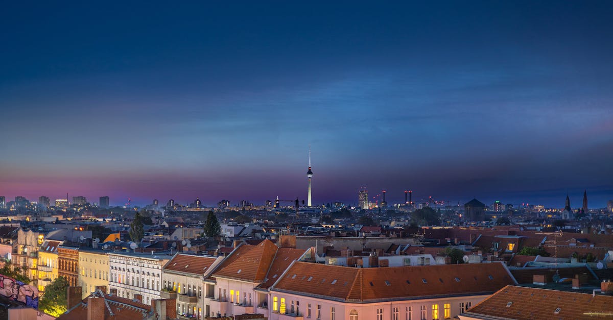 Panoramic view of Berlin skyline featuring the iconic TV Tower during twilight.