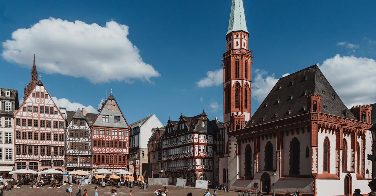 Picturesque Römerplatz in Frankfurt with historic buildings and St. Nicholas Church.