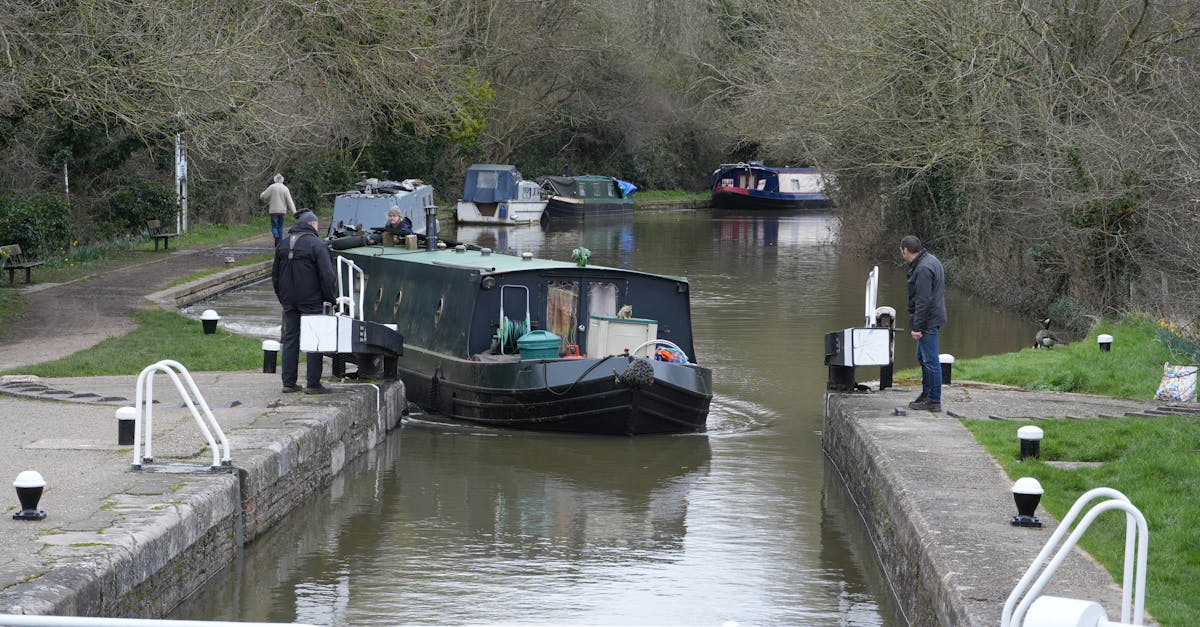 Scenic view of a barge passing through a lock on a canal in Rickmansworth, England.
