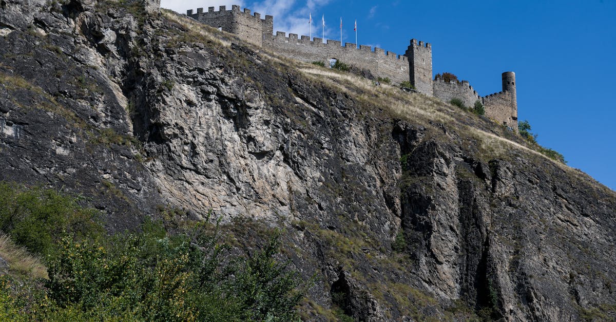 Historic Tourbillon Castle atop a rocky hill in Sion, Switzerland.