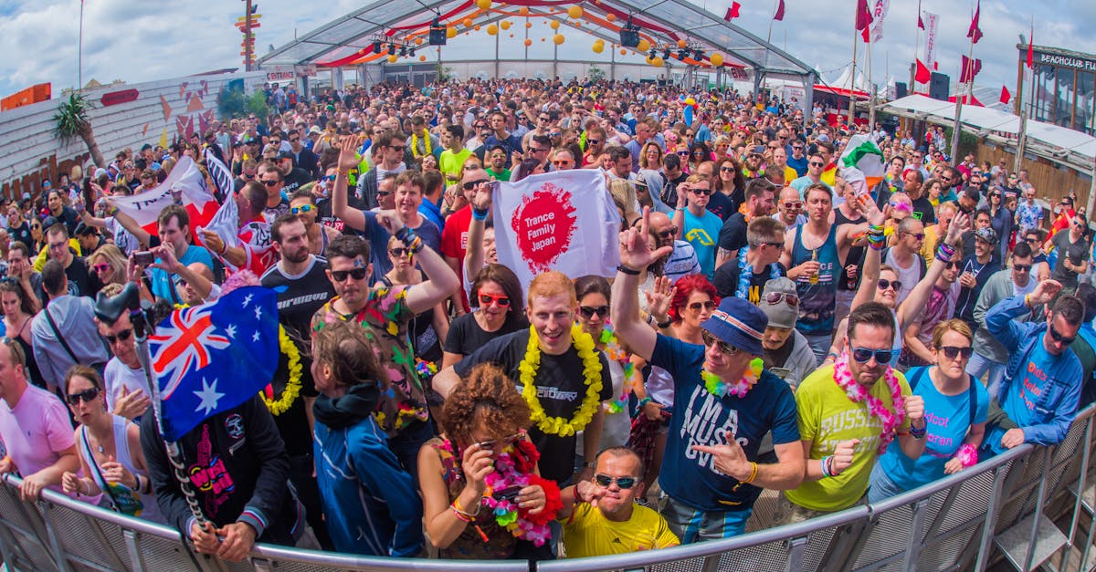 Lively outdoor crowd enjoying a summer music festival at Bloemendaal aan Zee, Netherlands.