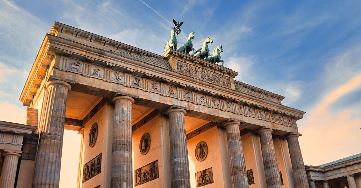 Stunning view of the Brandenburg Gate in Berlin during sunset, showcasing its iconic architecture.