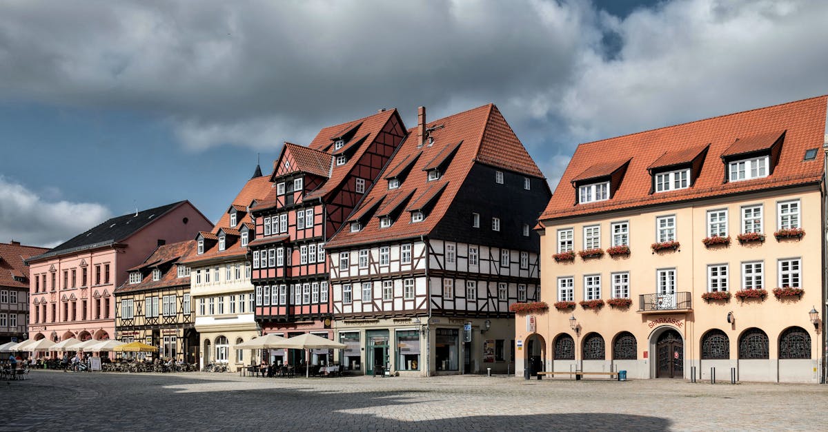 Explore the charming historic architecture of Quedlinburg's old town square with half-timbered houses.