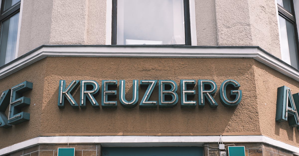 Close-up of a pharmacy facade with signage in Kreuzberg, Berlin. Urban architecture and typography.
