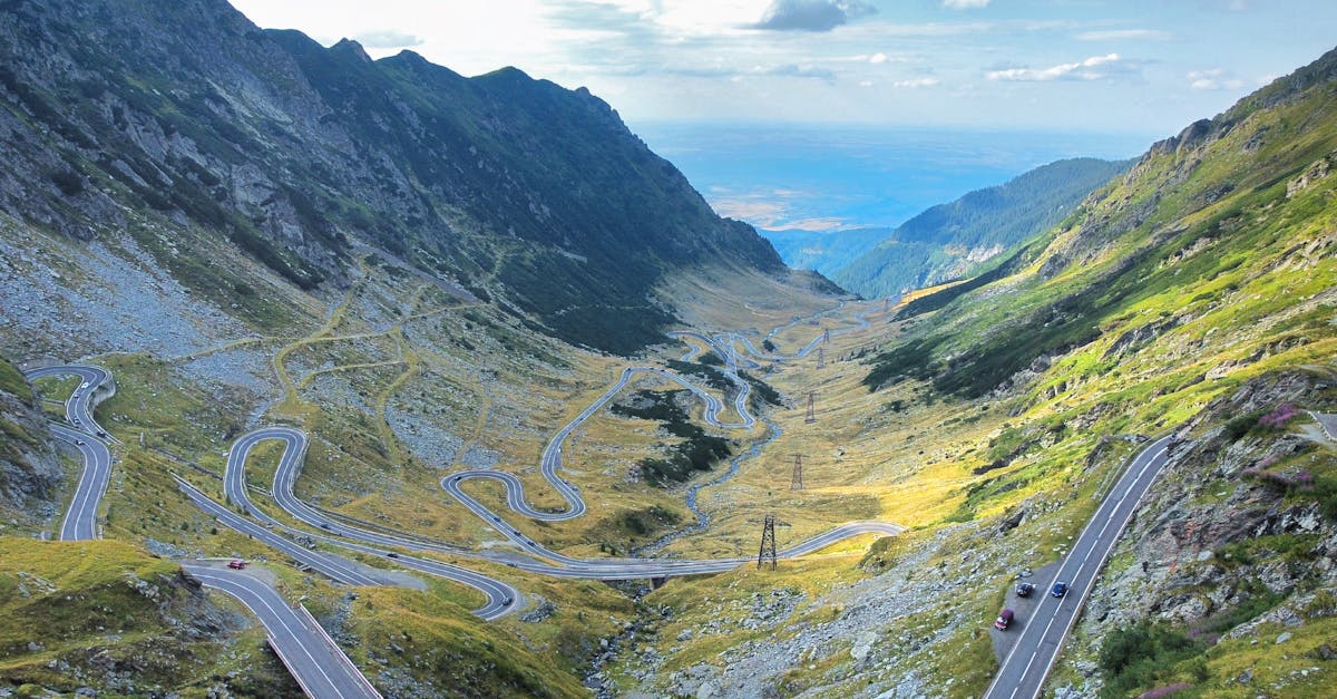 A breathtaking view of winding roads through mountainous terrain, ideal for travel images.