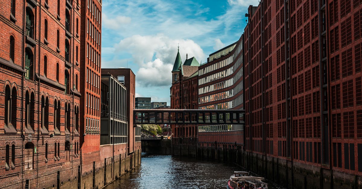 Discover the historic Speicherstadt district in Hamburg with its iconic red brick architecture and serene canal.