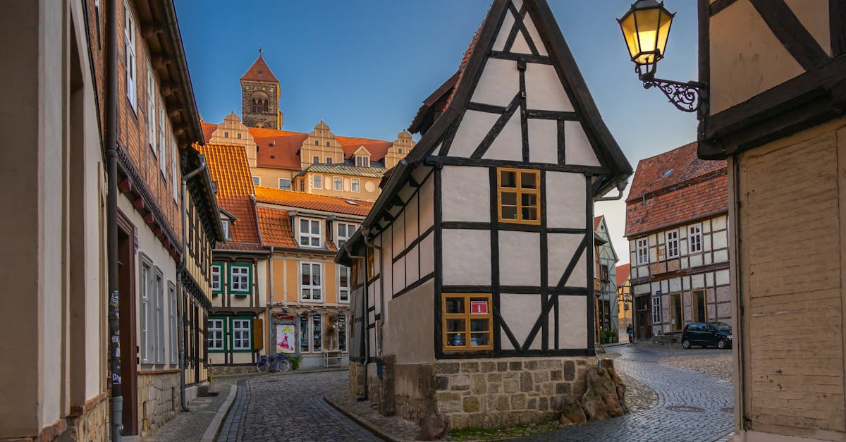 Explore the quaint medieval streets and timber-framed houses of Quedlinburg, Germany during a serene daytime stroll.