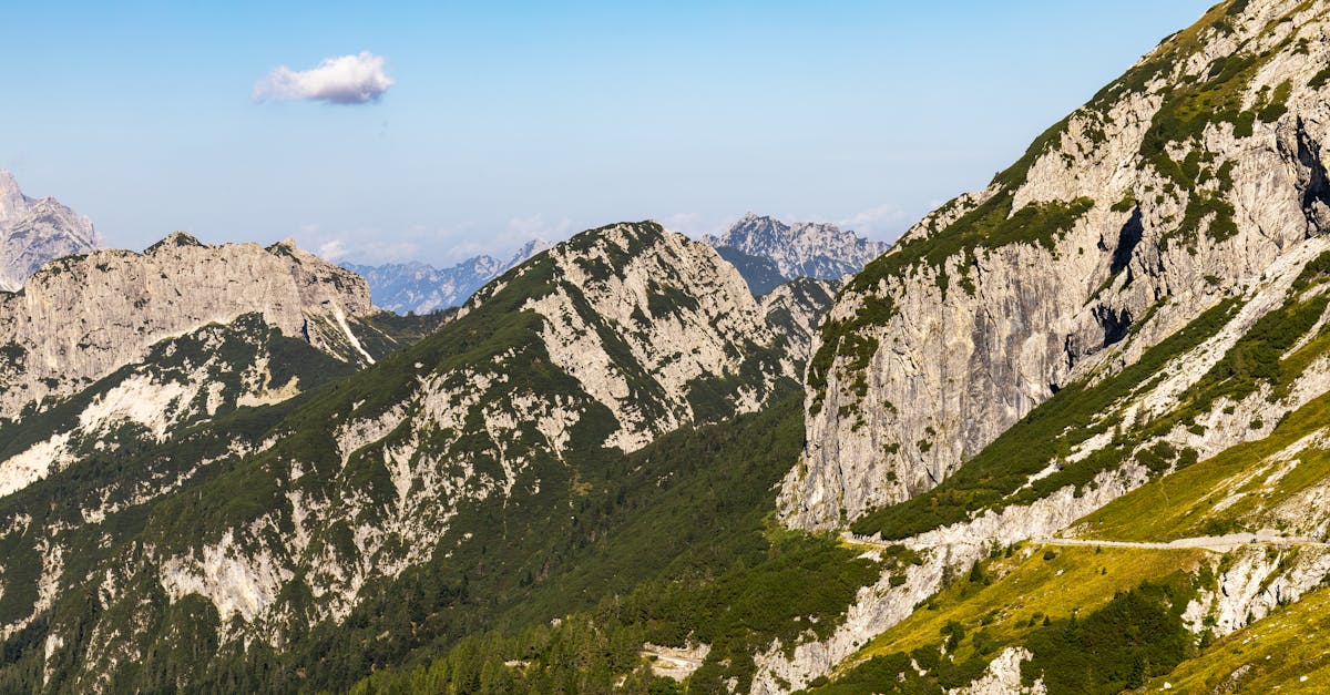 Breathtaking aerial view of the stunning Julian Alps under a clear blue sky.