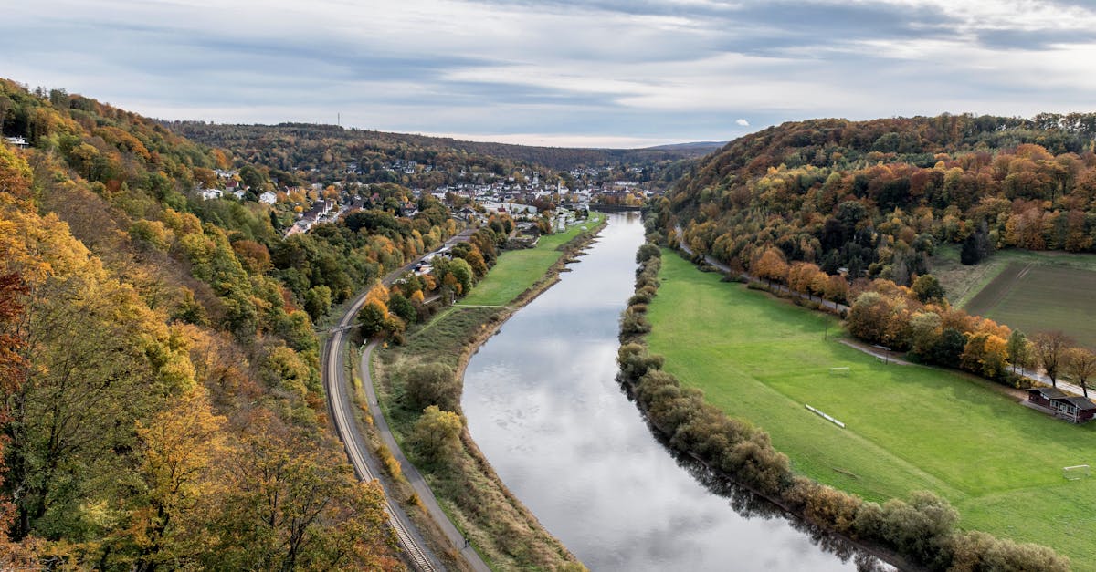 Aerial view of the Weser River and vibrant autumn landscape in Germany.
