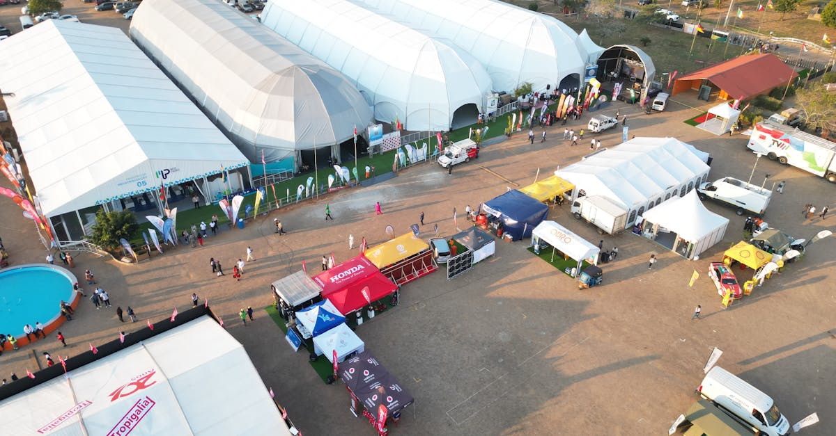 Aerial photo capturing an outdoor event with multiple tents in Maputo, Mozambique.
