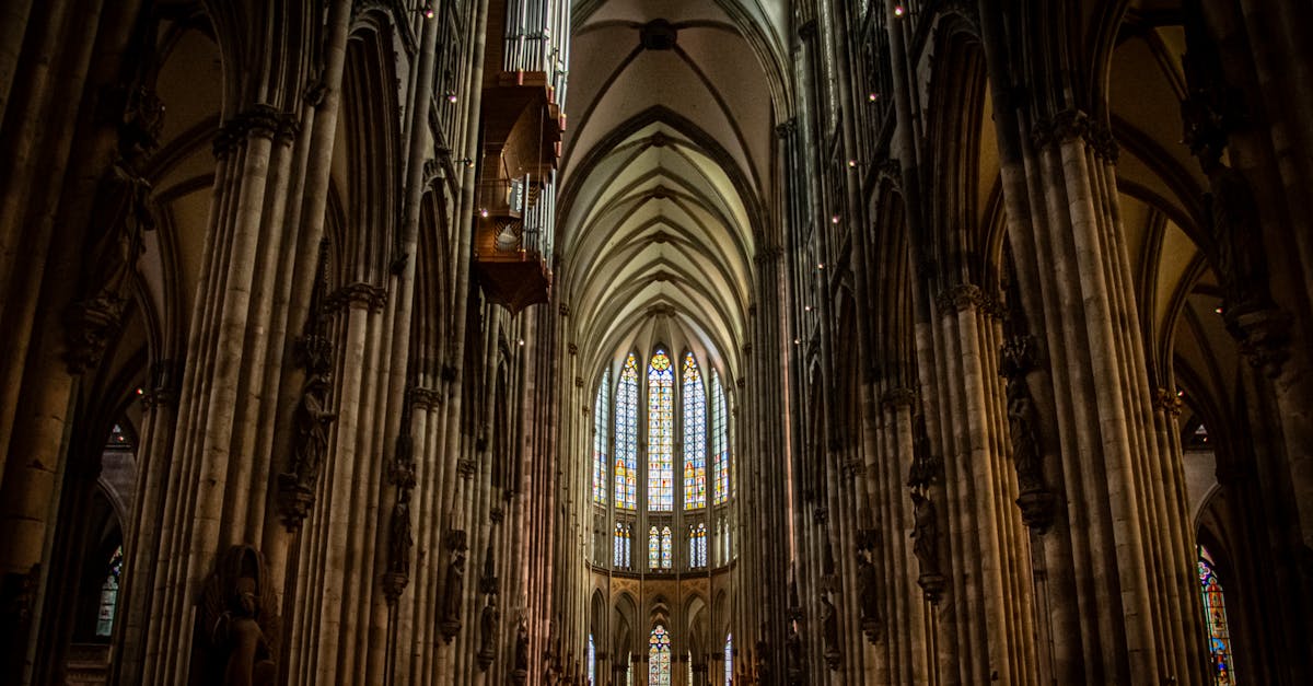 Explore the majestic interior of Cologne Cathedral, showcasing its Gothic architecture and stunning stained glass windows.
