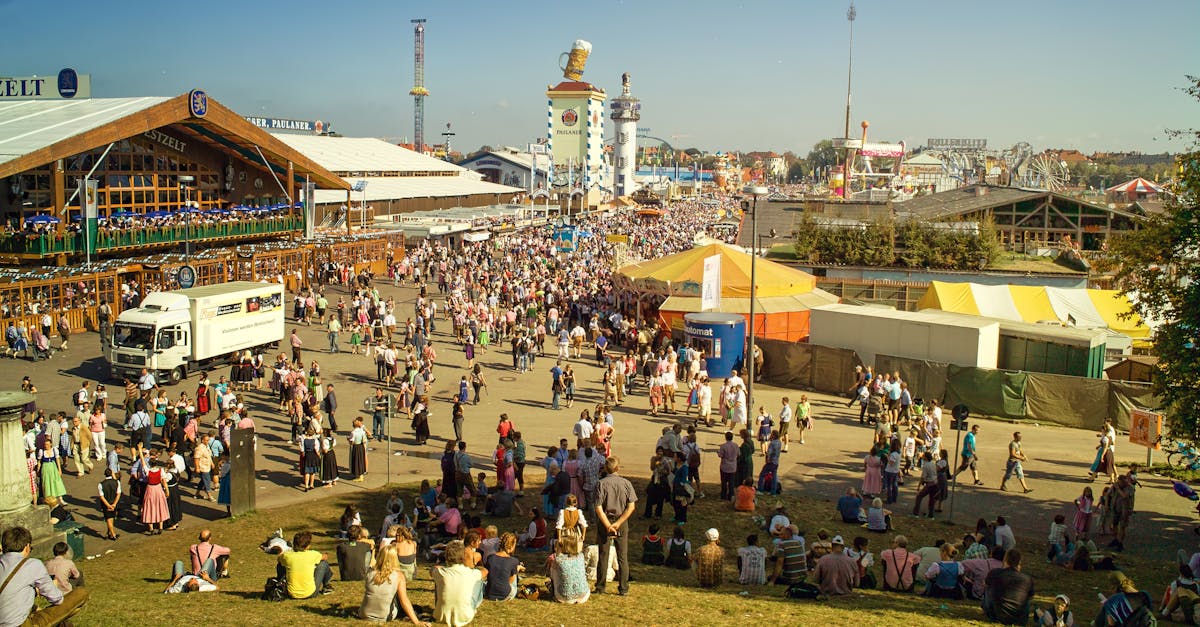 A bustling scene of people gathered at Oktoberfest, Munich, showcasing traditional attire and lively atmosphere.