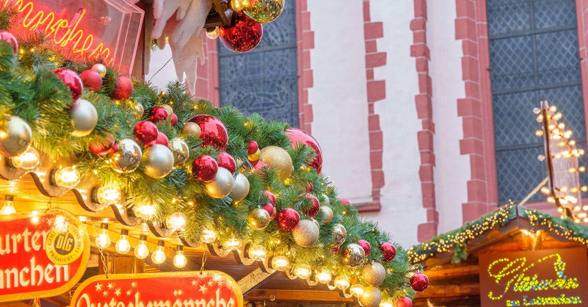 Vibrant Christmas market stall adorned with festive greenery and ornaments, creating a cozy holiday atmosphere.