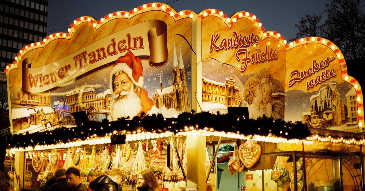 Illuminated Christmas market stall in Berlin showcasing traditional sweets and festive decor.