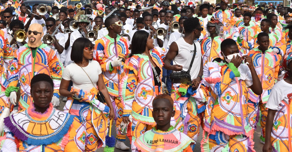 Energetic street parade featuring people in colorful costumes and musical instruments