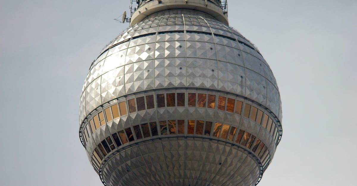 Detailed view of the Berlin Television Tower's spherical structure reflecting sunlight.