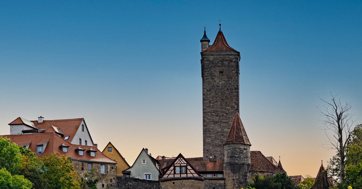 Charming view of Rothenburg ob der Tauber's medieval architecture against a twilight sky.