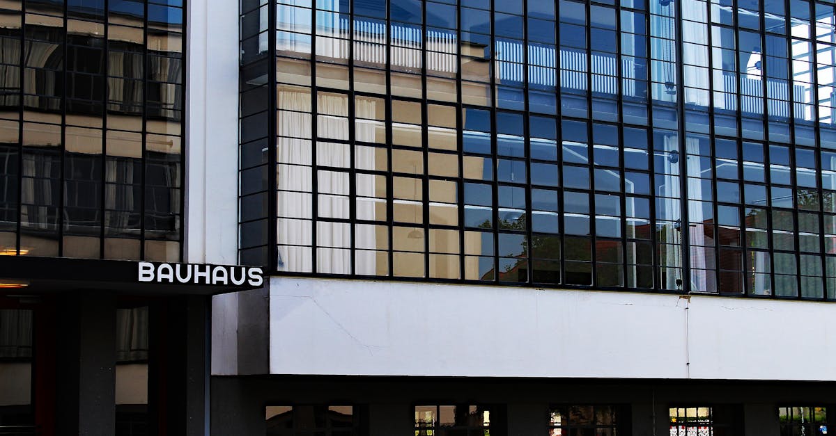 Modern Bauhaus architecture with glass facade in Dessau, Germany, showcasing iconic design.