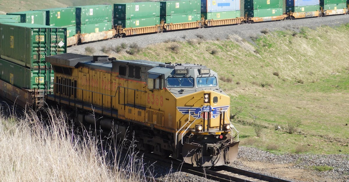 A Union Pacific freight train travels through the scenic hills of California, USA.