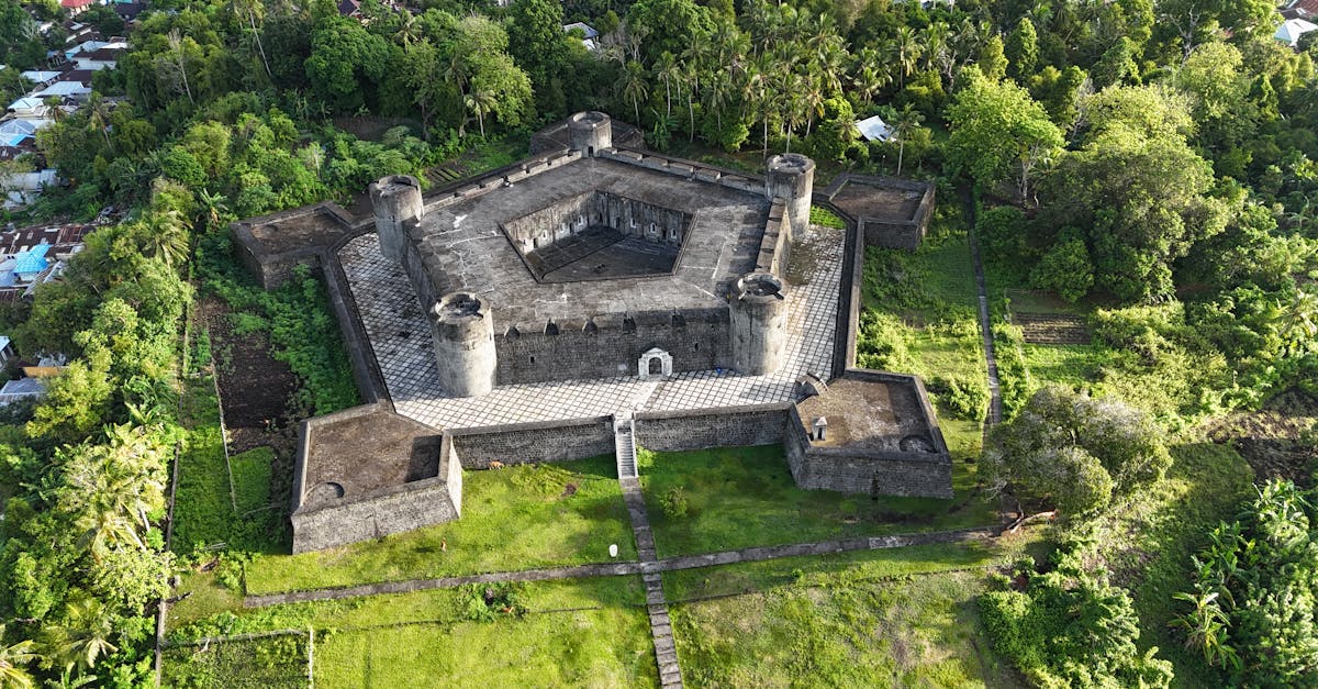 Stunning aerial view of the historic Fort Belgica surrounded by lush greenery in Banda Neira, Indonesia.
