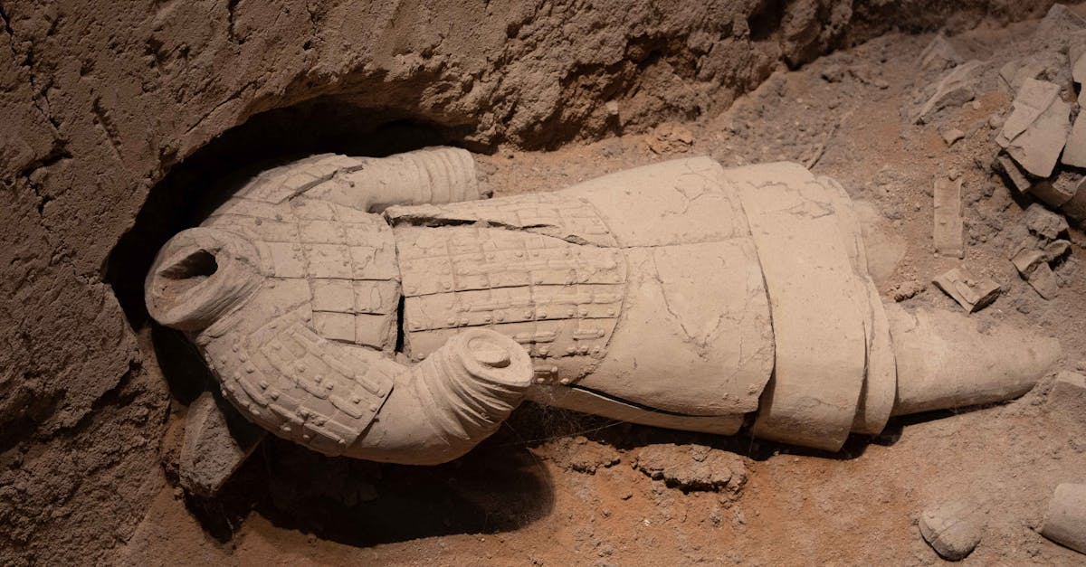 A fallen Terracotta Warrior amidst ruins in Xi'an, Shaanxi, China.