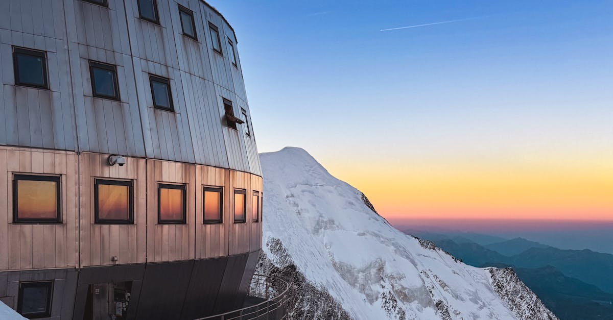 Stunning view of an alpine lodge with Mont Blanc at sunset in Saint-Gervais-les-Bains, France.