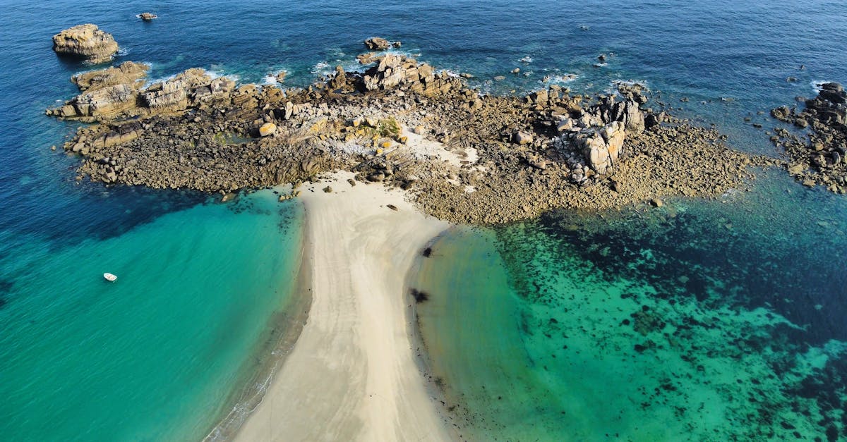 Stunning aerial view of the rocky coastline and turquoise waters in Bretagne, France.