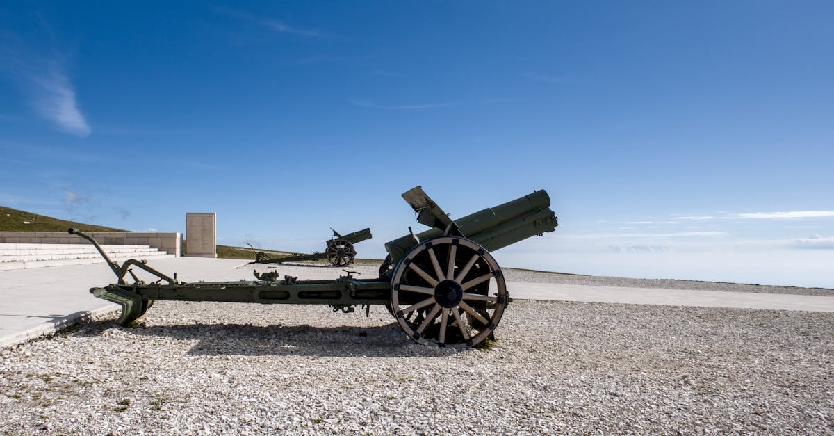 Old artillery cannon on display under clear skies in Veneto, Italy, historic war artifact.