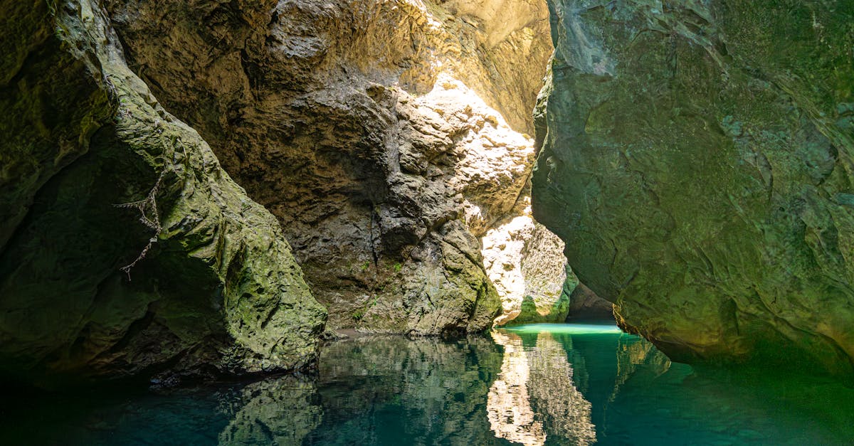 Discover a hidden sunlit gorge with turquoise waters and rocky formations.