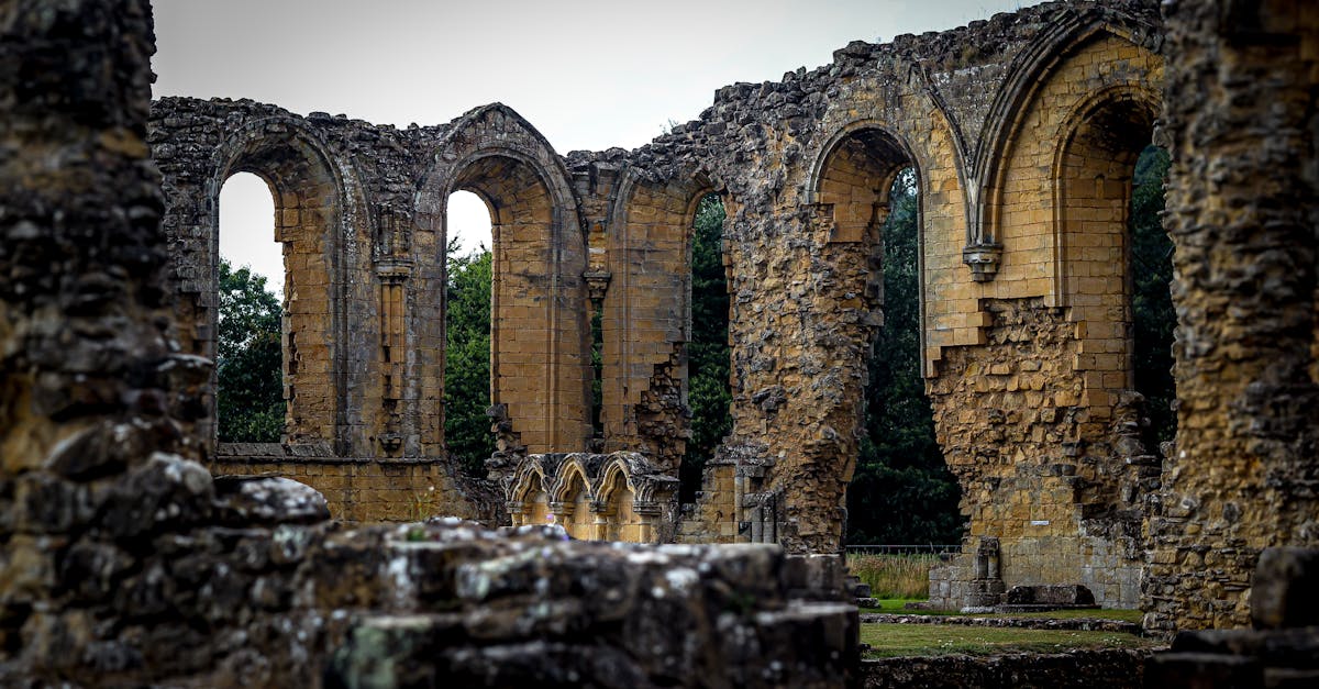 Explore the majestic Gothic arches of Byland Abbey, a stunning medieval ruin in England.
