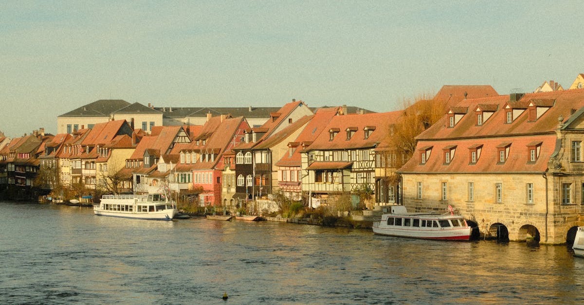 Scenic view of traditional buildings along Bamberg's riverfront showcasing historic charm and vibrant architecture.