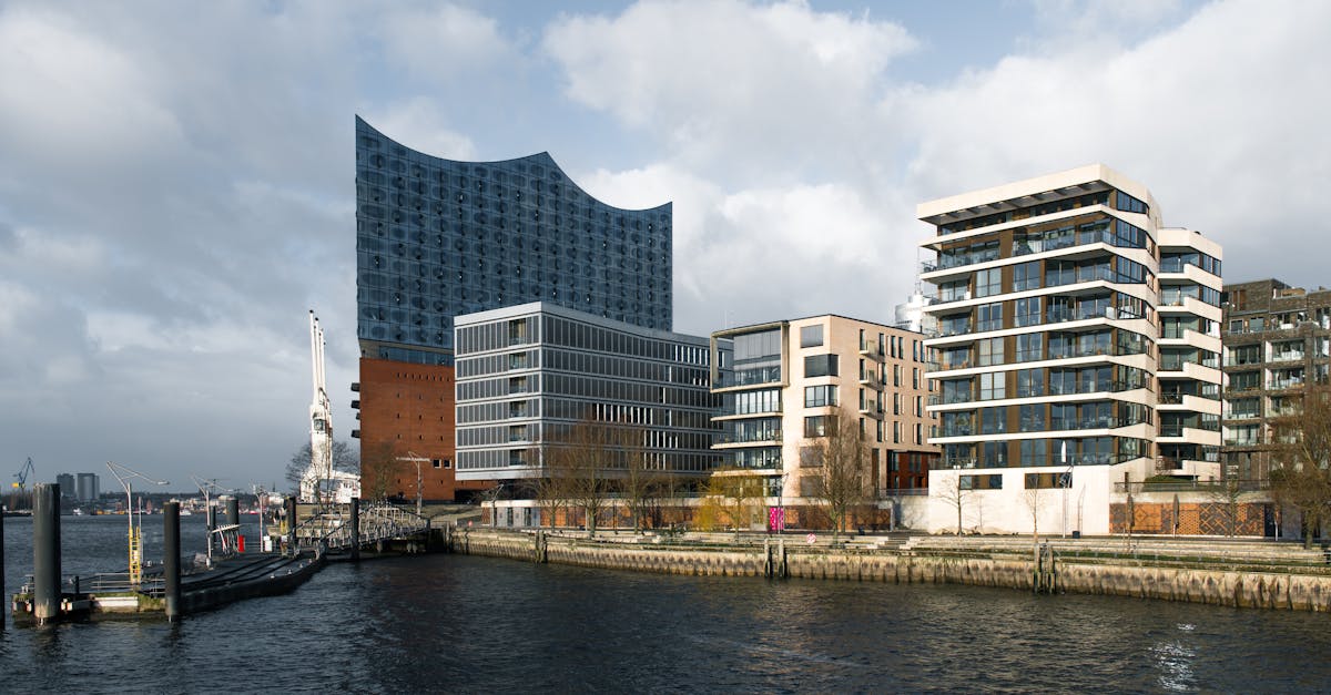Panoramic view of Elbphilharmonie in Hamburg's HafenCity with modern architecture.