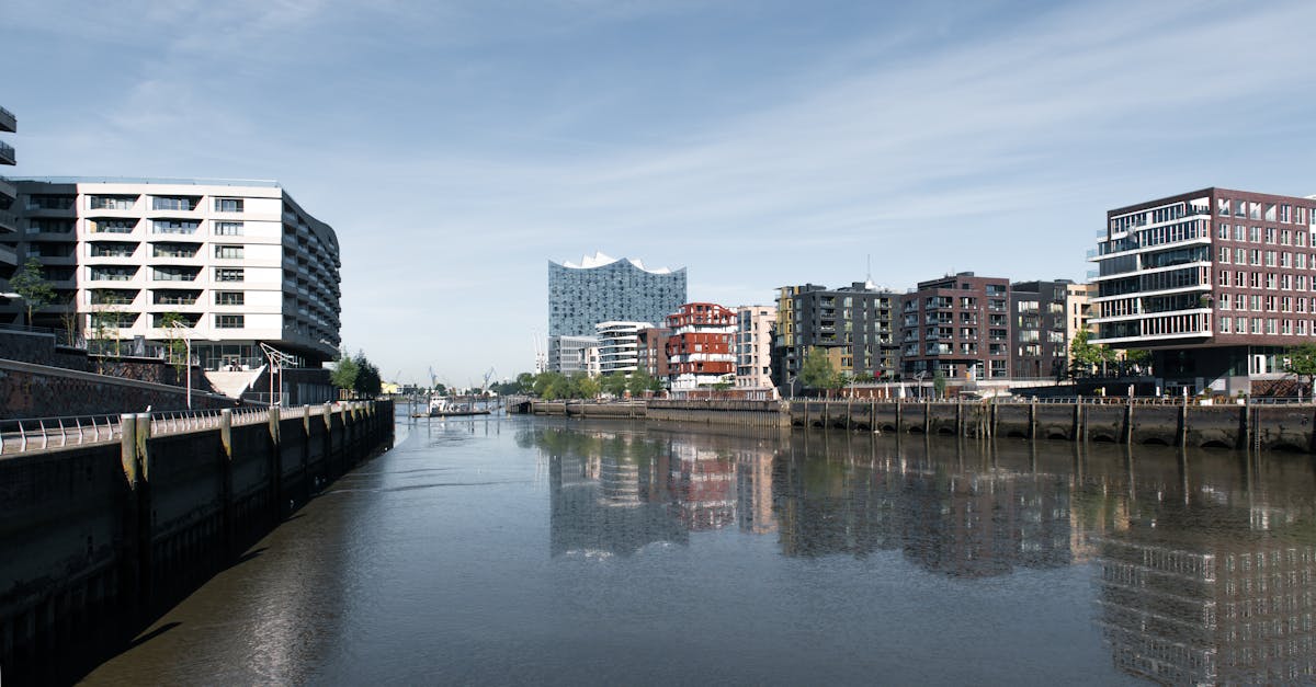 Modern architectural facades along the canal in Hamburg, showcasing iconic urban skyline.