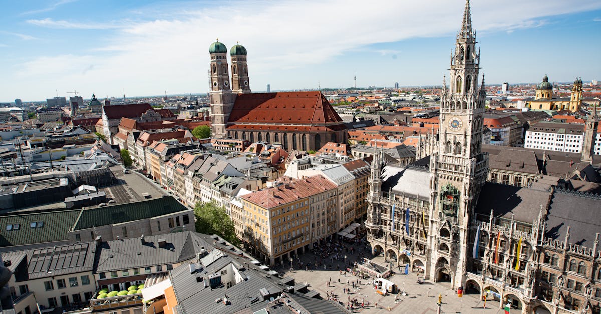 Majestic aerial view of Munich's Marienplatz and Frauenkirche showcasing historic architecture.