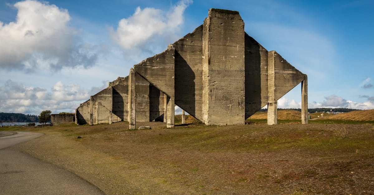 A striking view of abandoned World War II concrete fortifications under a blue sky.