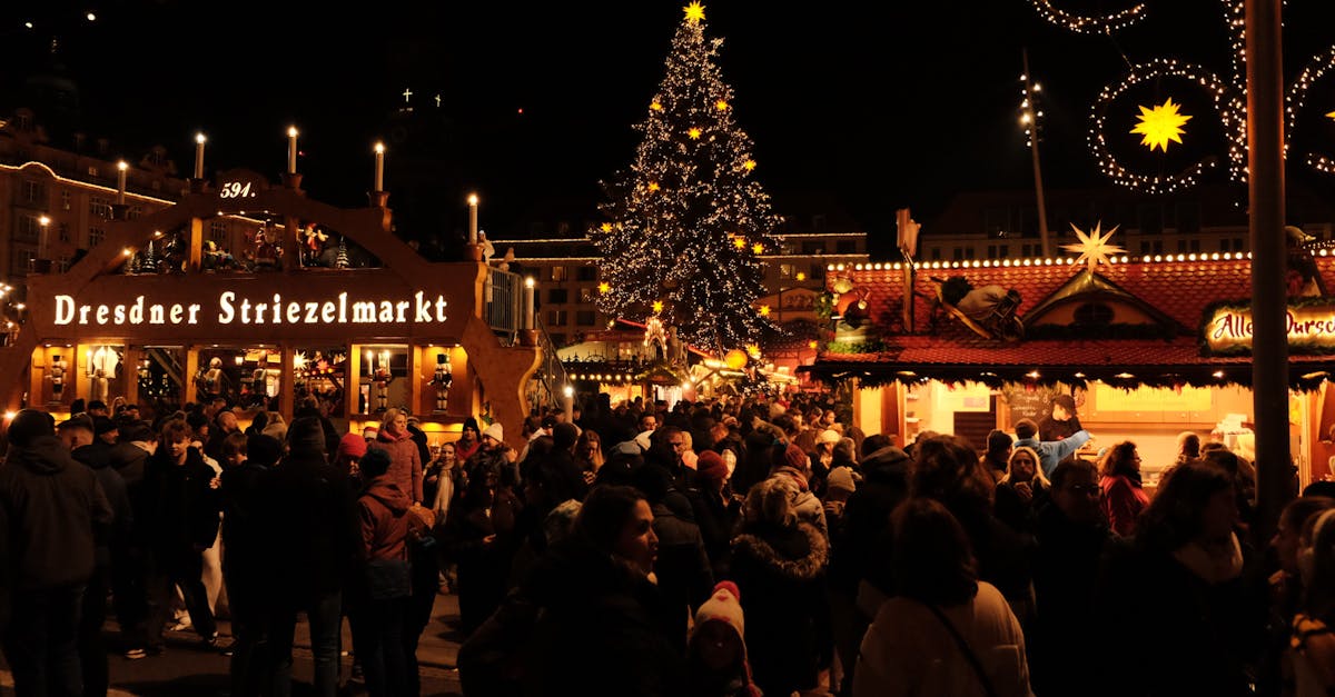 A bustling crowd enjoys the festive atmosphere at the Dresdner Striezelmarkt Christmas market.