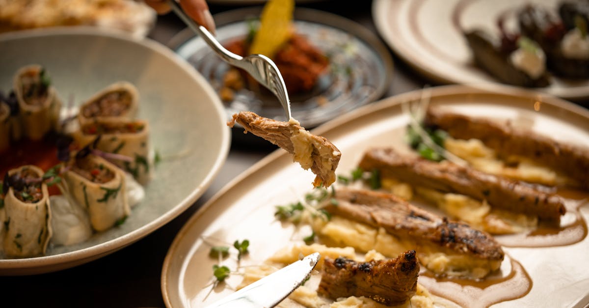 Close-up of a gourmet meal with diverse dishes, showcasing fine dining and sophisticated presentation.