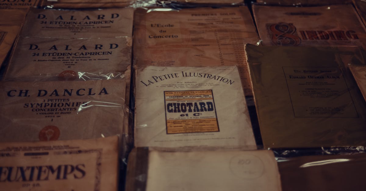 From above of various vintage music notation books placed on table in shop