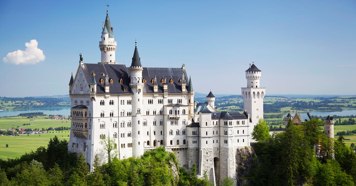 A stunning view of Neuschwanstein Castle amidst Bavaria's lush landscapes.