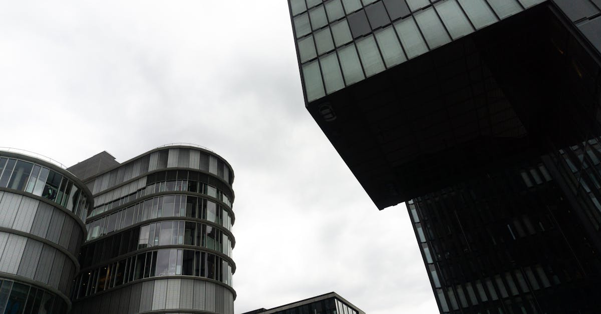 Contemporary buildings under a cloudy sky in Düsseldorf's urban center.