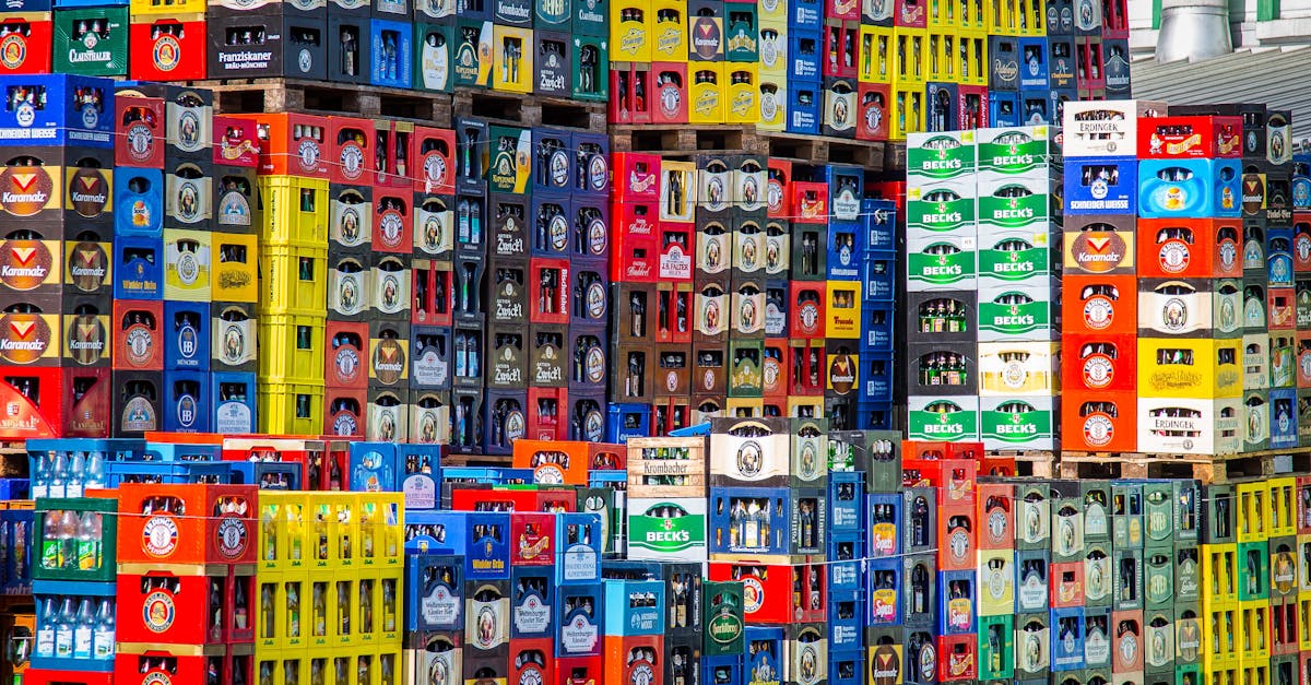 A vibrant display of beer crates stacked in a warehouse, showcasing various brands.